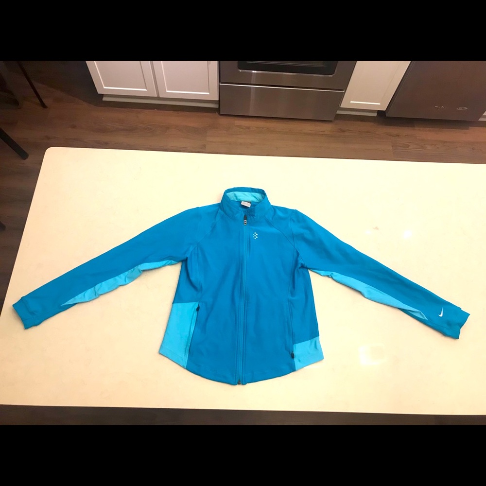 Nike turquoise athletic top. Women’s size M.